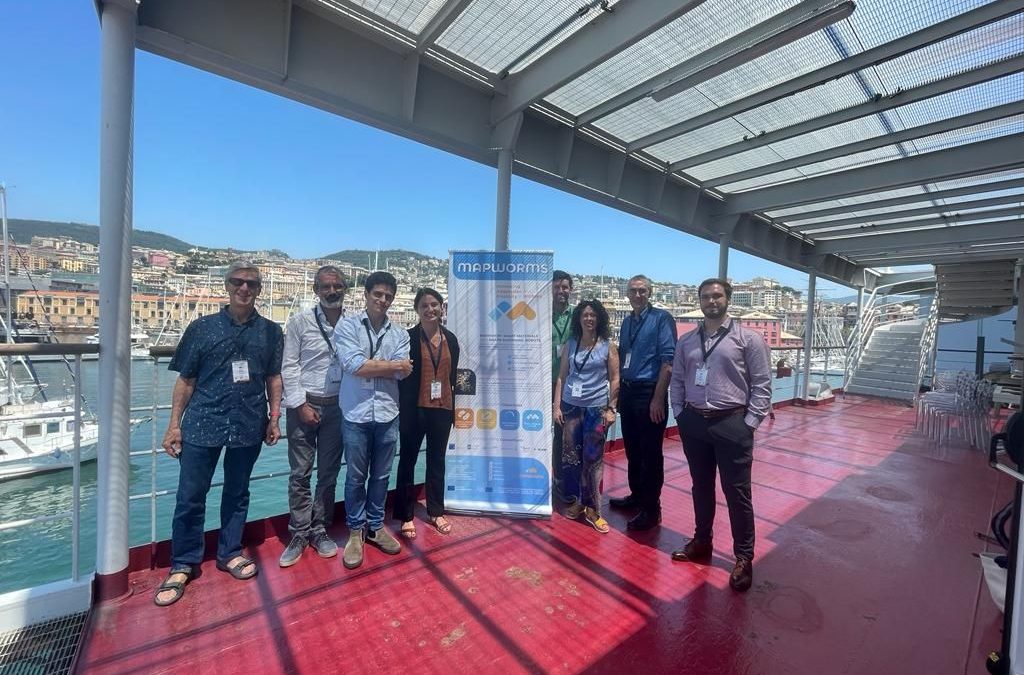 Group of people at the Living Machines 2023, in Genoa, Italy. They are attending the conference to discuss the influence of living systems on technologies.